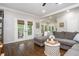 Inviting living room with hardwood floors and French doors leading to an outdoor space at 1161 Arborhill Dr, Woodstock, GA 30189