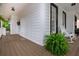 Relaxing porch with a rocking chair and view of the landscaped yard, perfect for enjoying the outdoors at 1161 Arborhill Dr, Woodstock, GA 30189