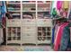 Custom walk-in closet with ample shelving, drawers, and storage for shoes, clothing, and accessories at 1161 Arborhill Dr, Woodstock, GA 30189