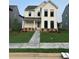 Charming two-story home with a beautifully landscaped front yard and classic white siding at 3482 Adler Trl, Buford, GA 30519