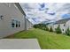 New construction backyard featuring a concrete patio and lawn at 3968 Annsbury Court, Lilburn, GA 30047