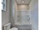 Bathroom showcasing a toilet, bathtub, and shower combination at 3968 Annsbury Court, Lilburn, GA 30047