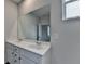 Bathroom featuring a double sink vanity and a large mirror at 3968 Annsbury Court, Lilburn, GA 30047