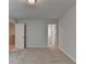 A bedroom featuring an open closet door and plush carpet floors at 3968 Annsbury Court, Lilburn, GA 30047