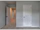 Bedroom featuring plush carpet and a closet visible through the open door at 3968 Annsbury Court, Lilburn, GA 30047