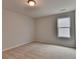 Neutral bedroom featuring plush carpet and a window providing natural light at 3968 Annsbury Court, Lilburn, GA 30047