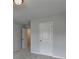 Bedroom featuring plush carpet and a closet visible through the open door at 3968 Annsbury Court, Lilburn, GA 30047