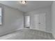 Neutral bedroom featuring carpet flooring, light walls, and a walk-in closet and window at 3968 Annsbury Court, Lilburn, GA 30047