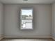 Bedroom featuring plush carpet and a window providing natural light and views at 3968 Annsbury Court, Lilburn, GA 30047