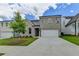 Attractive two-story house featuring a brick facade, two-car garage, and a well-maintained lawn at 3968 Annsbury Court, Lilburn, GA 30047
