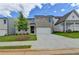 Beautiful home showcasing a brick exterior, attached garage, complemented by green lawn and landscaping at 3968 Annsbury Court, Lilburn, GA 30047