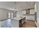 Stylish kitchen featuring stainless steel appliances, a central island, and ample cabinet storage at 3968 Annsbury Court, Lilburn, GA 30047