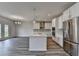 Modern kitchen showcasing stainless steel appliances, a kitchen island, and plenty of cabinet space at 3968 Annsbury Court, Lilburn, GA 30047