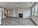 Open living area with wood floors, fireplace, and recessed lighting at 3968 Annsbury Court, Lilburn, GA 30047