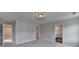 Bright main bedroom with neutral walls, carpet, bathroom and walk-in closet entrances at 3968 Annsbury Court, Lilburn, GA 30047