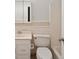 Tiled bathroom featuring a single sink vanity, toilet, and shower/tub combination at 5400 Roswell Rd # L-3, Atlanta, GA 30342