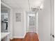 Hallway view featuring wood flooring and access to the kitchen and bedroom at 5400 Roswell Rd # L-3, Atlanta, GA 30342