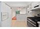 Spacious kitchen with stainless steel appliances and an open view of the living area at 5400 Roswell Rd # L-3, Atlanta, GA 30342