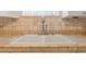 Close-up of a dual basin kitchen sink with a tiled countertop and backsplash at 5400 Roswell Rd # L-3, Atlanta, GA 30342