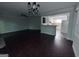 View of living room featuring hardwood floors, a ceiling fan, and chandelier at 5400 Roswell Rd # L-3, Atlanta, GA 30342