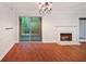 Living room featuring hardwood floors, a fireplace, and sliding glass doors to the outside at 5400 Roswell Rd # L-3, Atlanta, GA 30342