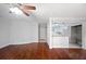Living room featuring hardwood floors that open to a kitchen bar at 5400 Roswell Rd # L-3, Atlanta, GA 30342