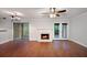 Cozy living room featuring a fireplace, hardwood floors, and sliding glass doors to the outside at 5400 Roswell Rd # L-3, Atlanta, GA 30342