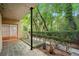 An inviting outdoor area with greenery and a porch provides a serene space at 5400 Roswell Rd # L-3, Atlanta, GA 30342