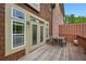 Charming back deck perfect for entertaining, featuring wood floors and a dining table at 62 High Top Pt, Sandy Springs, GA 30328