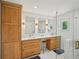 Bright bathroom featuring double sink vanity with wood cabinets and glass shower at 62 High Top Pt, Sandy Springs, GA 30328