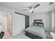 Modern bedroom with barn door closet, streamlined furnishings, and ceiling fan at 62 High Top Pt, Sandy Springs, GA 30328