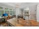 Bright dining room with hardwood floors, a rustic table, and modern lighting at 62 High Top Pt, Sandy Springs, GA 30328