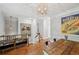 Elegant dining area with rustic table, stylish lighting, and artistic decor at 62 High Top Pt, Sandy Springs, GA 30328