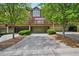 Townhome with a multi-car garage, private decks, mature trees, and beautiful landscaping at 62 High Top Pt, Sandy Springs, GA 30328