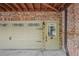 Attached garage door with brick exterior and decorative windows and door with address number at 62 High Top Pt, Sandy Springs, GA 30328