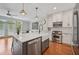 Modern kitchen with a large island, stainless steel appliances, and open layout at 62 High Top Pt, Sandy Springs, GA 30328