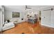 Spacious open floor plan with hardwood flooring, kitchen island, and a comfortable seating area at 62 High Top Pt, Sandy Springs, GA 30328