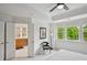 Bright main bedroom includes a view to the ensuite bath with double vanity sinks and a window at 62 High Top Pt, Sandy Springs, GA 30328
