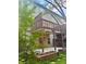 Multi-level back deck with green foliage surrounding the yard at 702 Emeril Dr, Avondale Estates, GA 30002