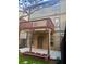 Backyard view featuring a patio with a ceiling fan and a wooden balcony above at 702 Emeril Dr, Avondale Estates, GA 30002