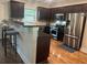 Kitchen with stainless steel appliances and dark brown cabinets at 702 Emeril Dr, Avondale Estates, GA 30002