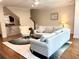 Bright living room with hardwood floors, plush seating, and staircase view at 702 Emeril Dr, Avondale Estates, GA 30002