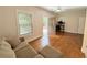 Cozy living room area featuring a view into the office, neutral paint, and hardwood floors at 702 Emeril Dr, Avondale Estates, GA 30002