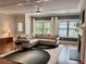 Bright living room featuring hardwood floors, a fireplace, and large windows at 702 Emeril Dr, Avondale Estates, GA 30002