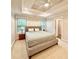 Serene main bedroom with tray ceiling, neutral tones, and ample natural light at 702 Emeril Dr, Avondale Estates, GA 30002