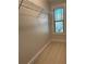 Walk-in closet with wire shelving system and a window to provide natural light at 702 Emeril Dr, Avondale Estates, GA 30002