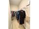Functional walk-in closet with ample storage and clothing racks at 702 Emeril Dr, Avondale Estates, GA 30002