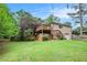 Enjoy the outdoors with this spacious backyard featuring a multilevel deck, green lawn, and mature trees for privacy at 2790 Westhampton Way, Tucker, GA 30084