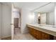 This bathroom features a single vanity, a large mirror, and a toilet and shower accessible through an open doorway at 2790 Westhampton Way, Tucker, GA 30084
