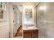 Bathroom with a glass-enclosed shower, and a light-toned countertop on a wooden vanity at 2790 Westhampton Way, Tucker, GA 30084